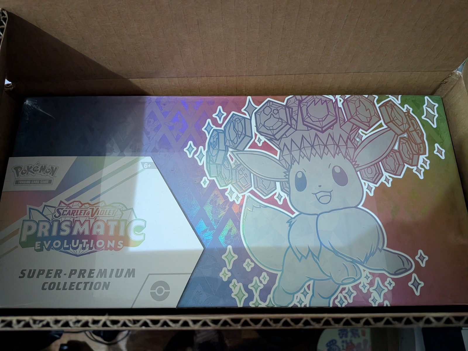 Opened Case of 4 – Pokémon Prismatic Evolutions Super Premium Collection Box